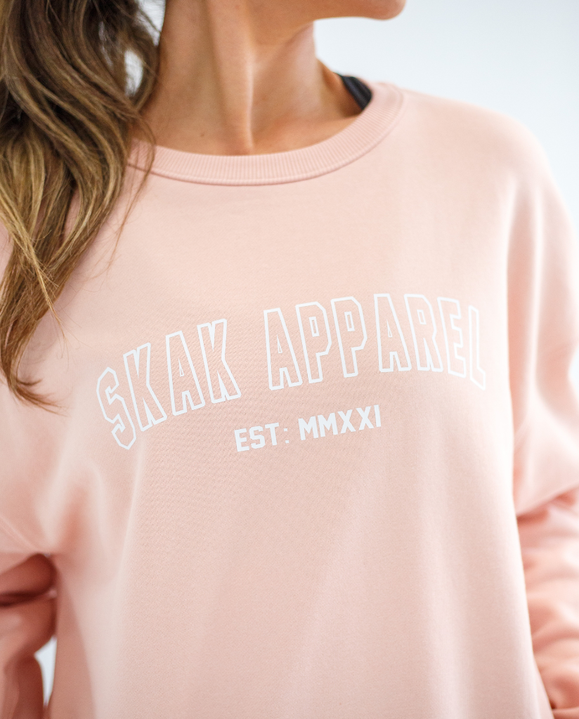 Stay cozy and stylish with our Ladies Crop Crew Neck in Pink, perfect for any casual occasion