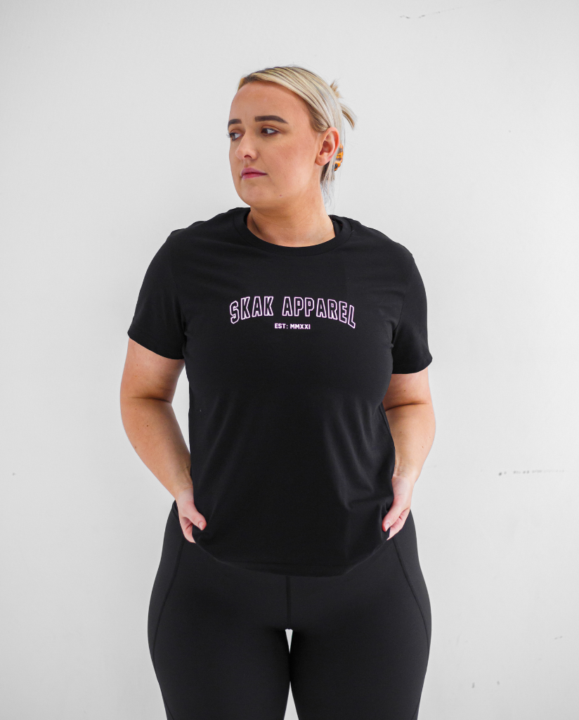 Stay motivated and stylish with our Ladies Athletic Tee in Black, a versatile piece that effortlessly transitions from the gym to everyday wear