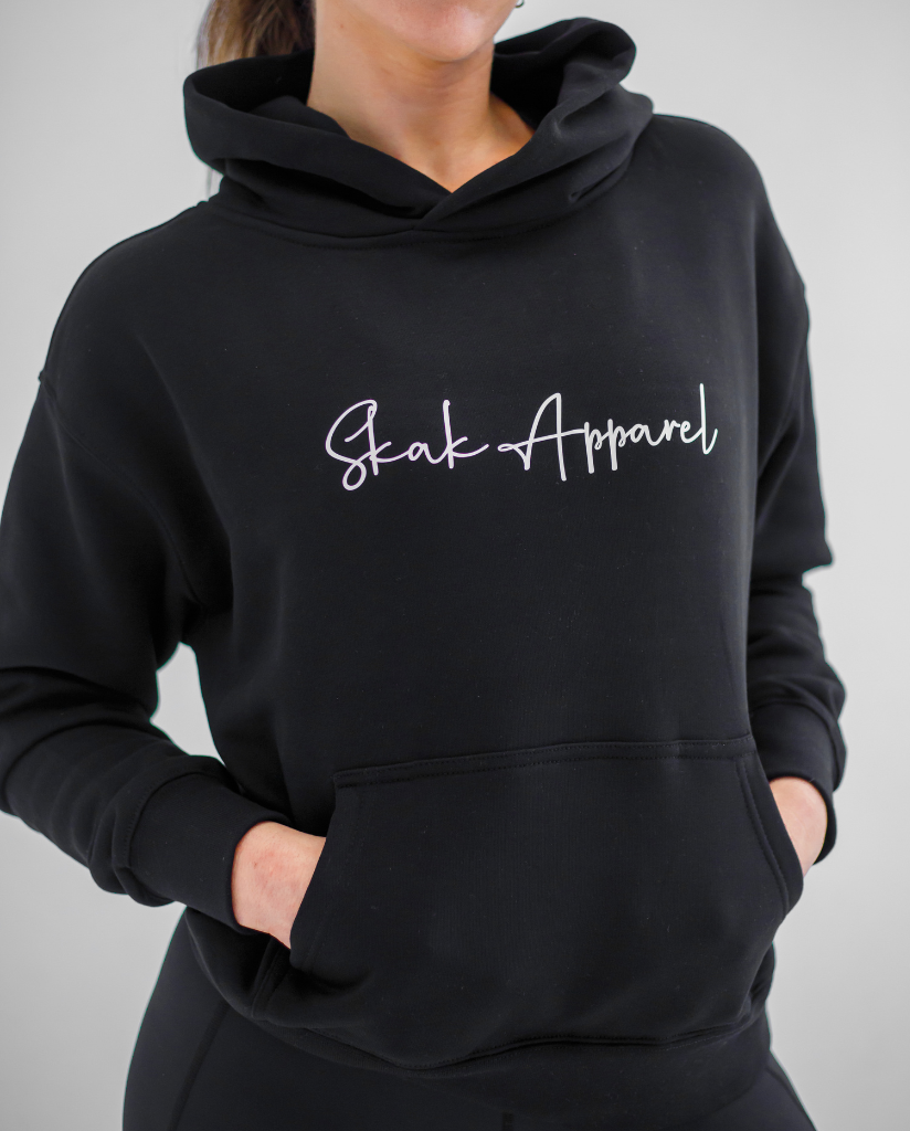 Experience ultimate warmth and style with our Ladies Signature Hoodie in Black, designed to keep you snug and fashionable