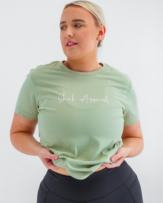 Upgrade your basics with our trendy Ladies Signature Tee in Pistachio, a versatile piece for any occasion